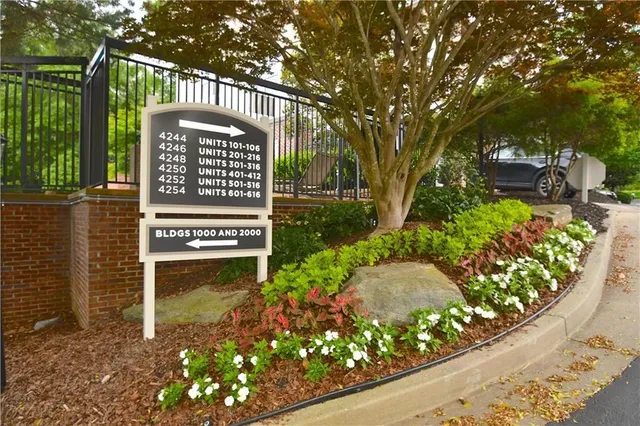 a swimming pool with outdoor seating and yard