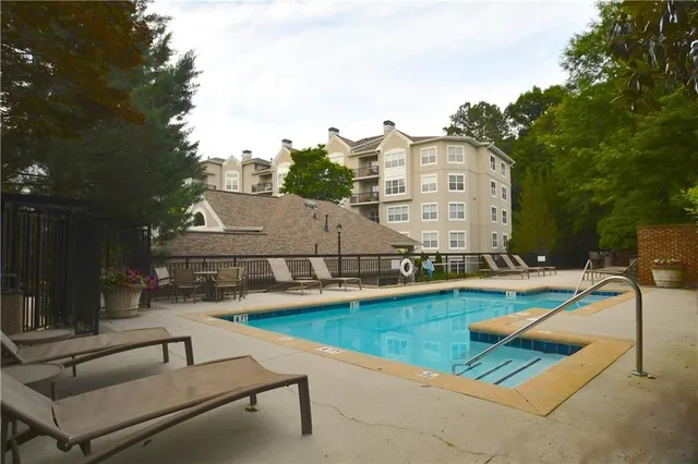 a sign that is sitting in front of flowers