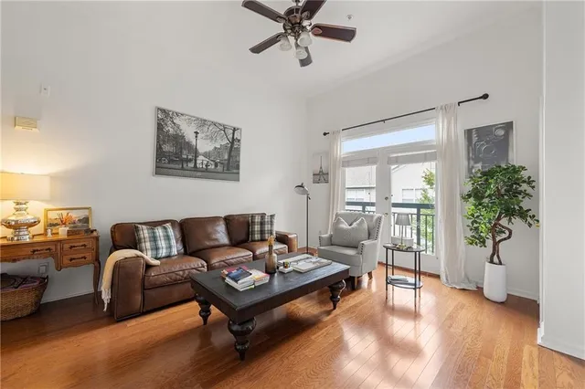 a living room with furniture and a potted plant