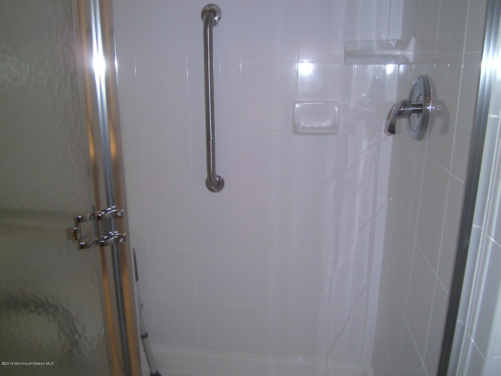 30 Meadow Green Circle, Unit E Manalapan, NJ 07726 - Photo 8 of 11 a bathroom with a shower