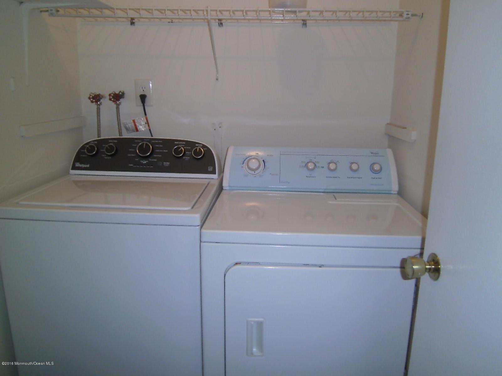 30 Meadow Green Circle, Unit E Manalapan, NJ 07726 - Photo 10 of 11 a close up view of a washer and dryer