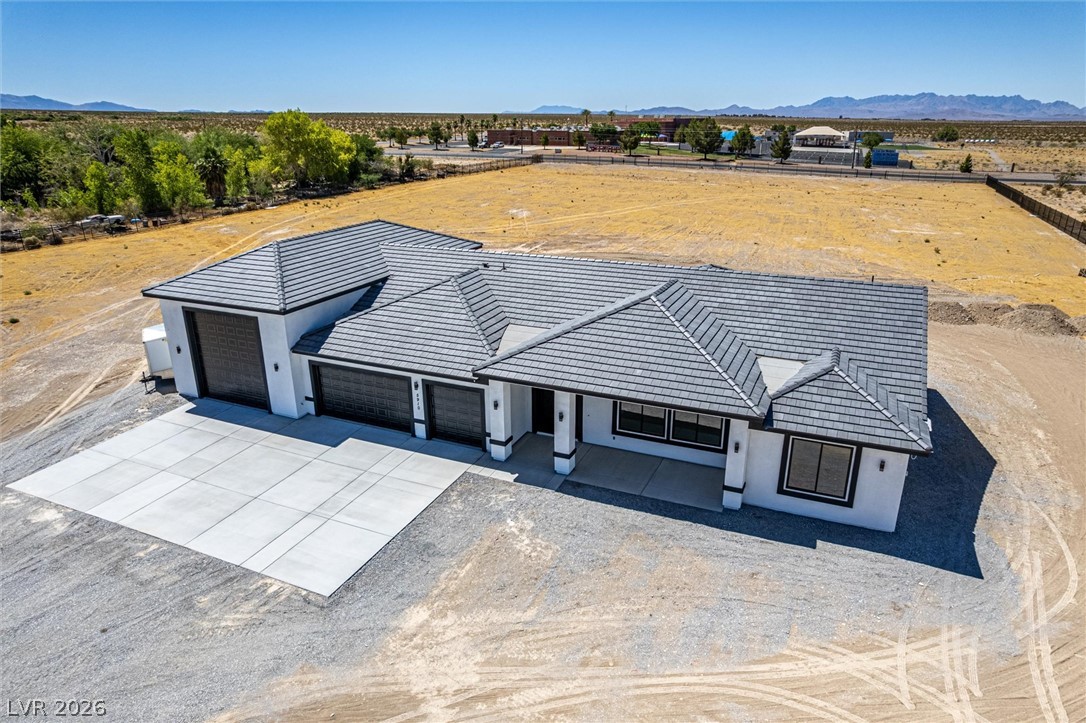 5910 East Kellogg Road Pahrump, NV 89061 - Photo 45 of 58 A newly constructed modern home awaits on a generous, sun-drenched lot.