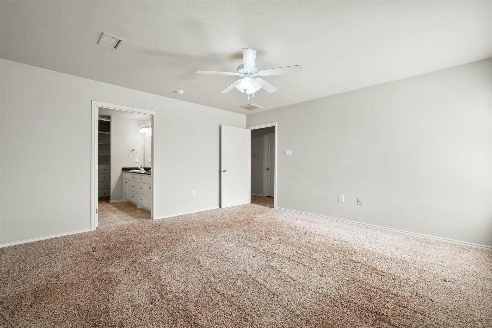 2619 113th Street Lubbock, TX 79423 - Photo 24 of 31 a view of empty room with a ceiling fan
