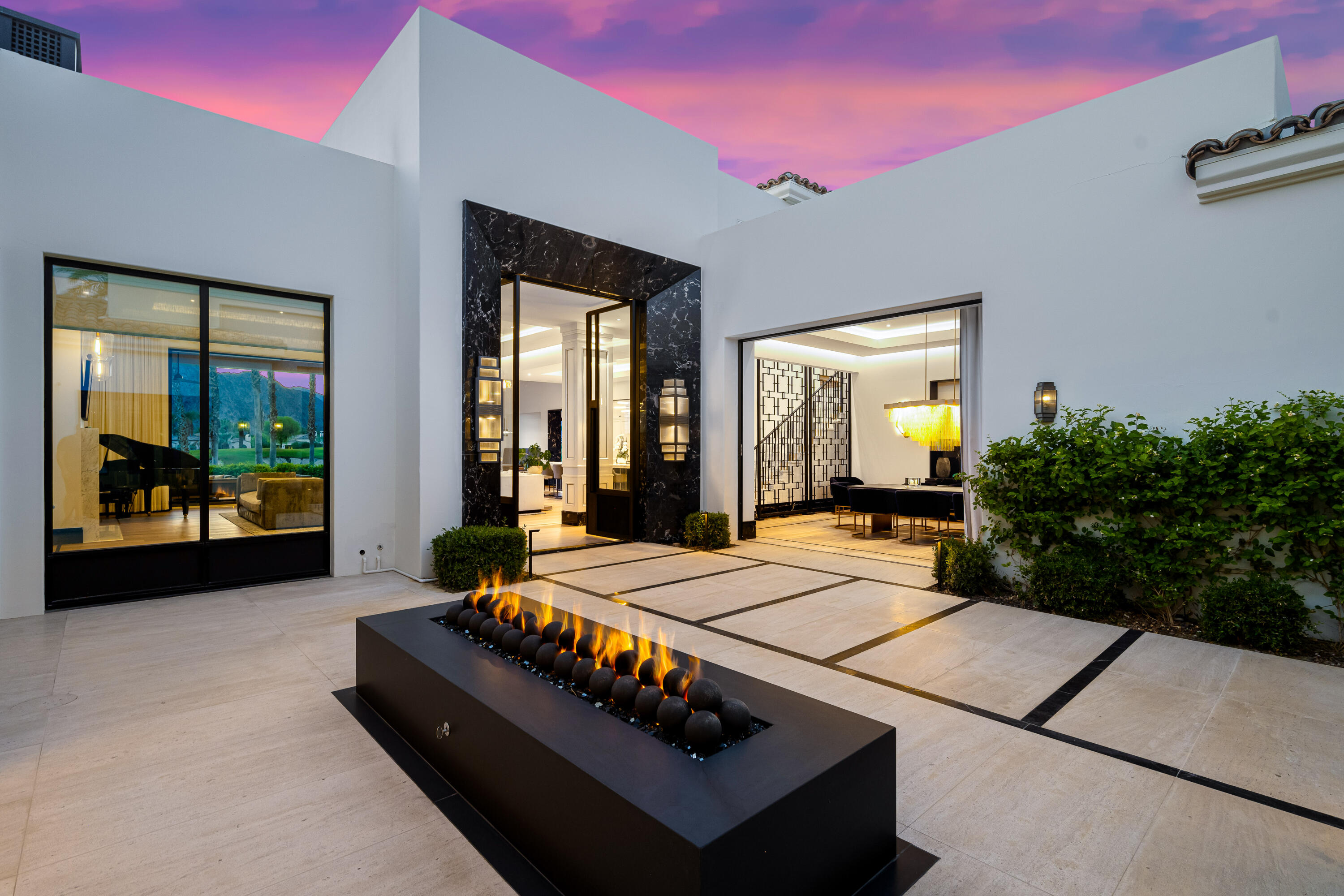53747 Via Strada La Quinta, CA 92253 - Photo 4 of 11 a living room with a bed furniture and next to a window