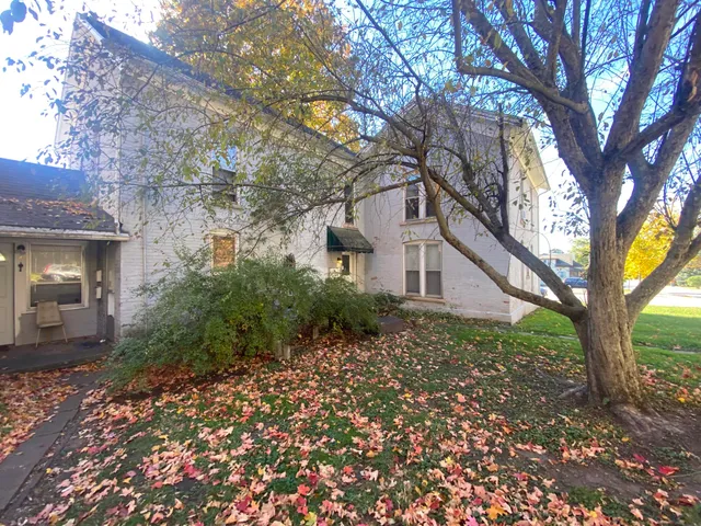 a house with a tree in front of it