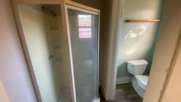 a view of a hallway with furniture
