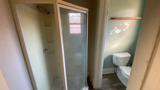 a view of a hallway with furniture