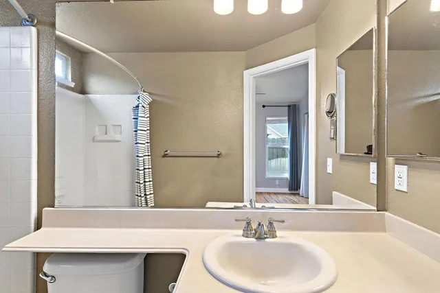 a bathroom with a sink and a mirror