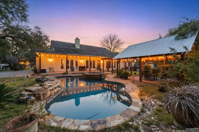 a view of a swimming pool with a patio