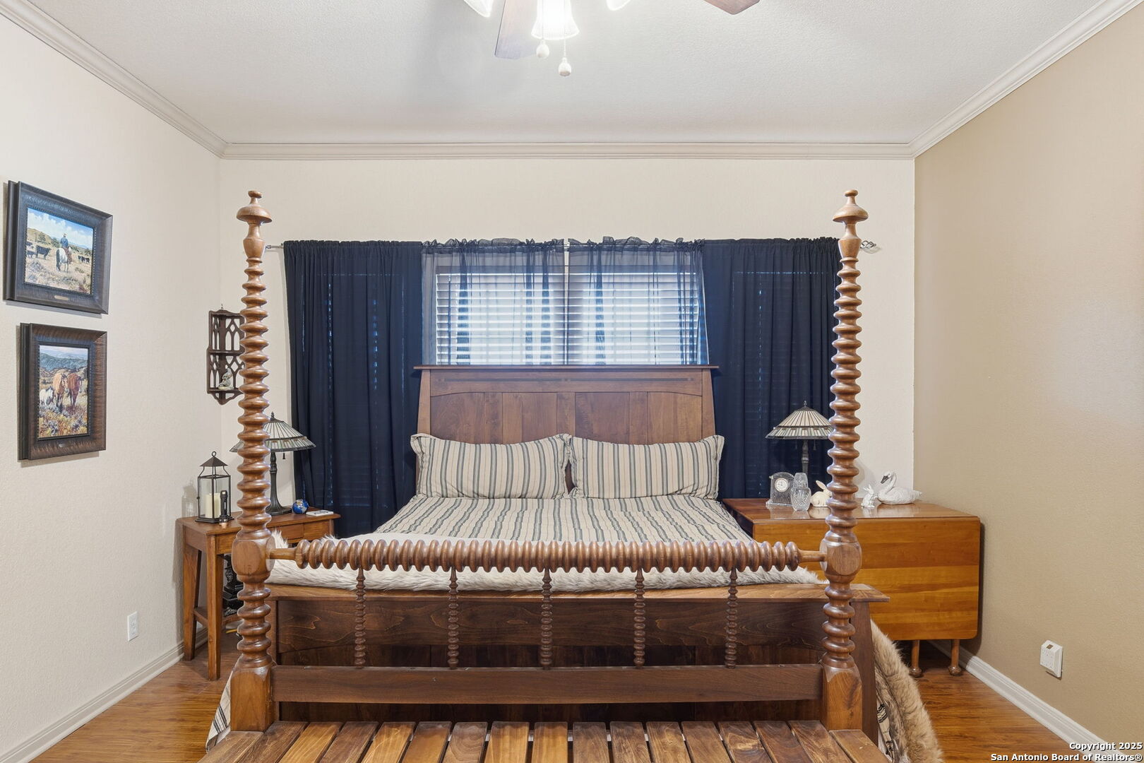 805 Paddy Road Floresville, TX 78114 - Photo 12 of 26 a bedroom with a bed and wooden floor