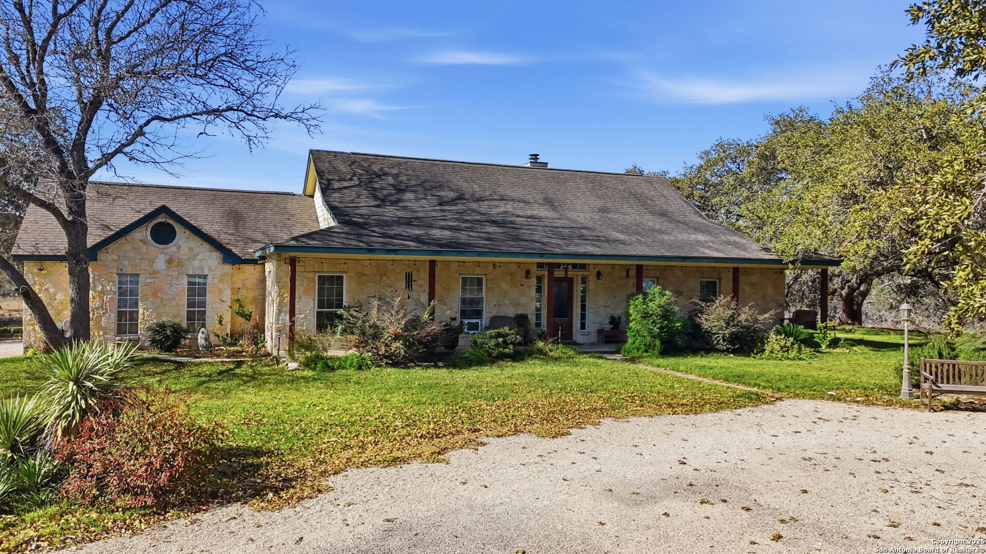 805 Paddy Road Floresville, TX 78114 - Photo 2 of 26 a view of a house with garden and yard