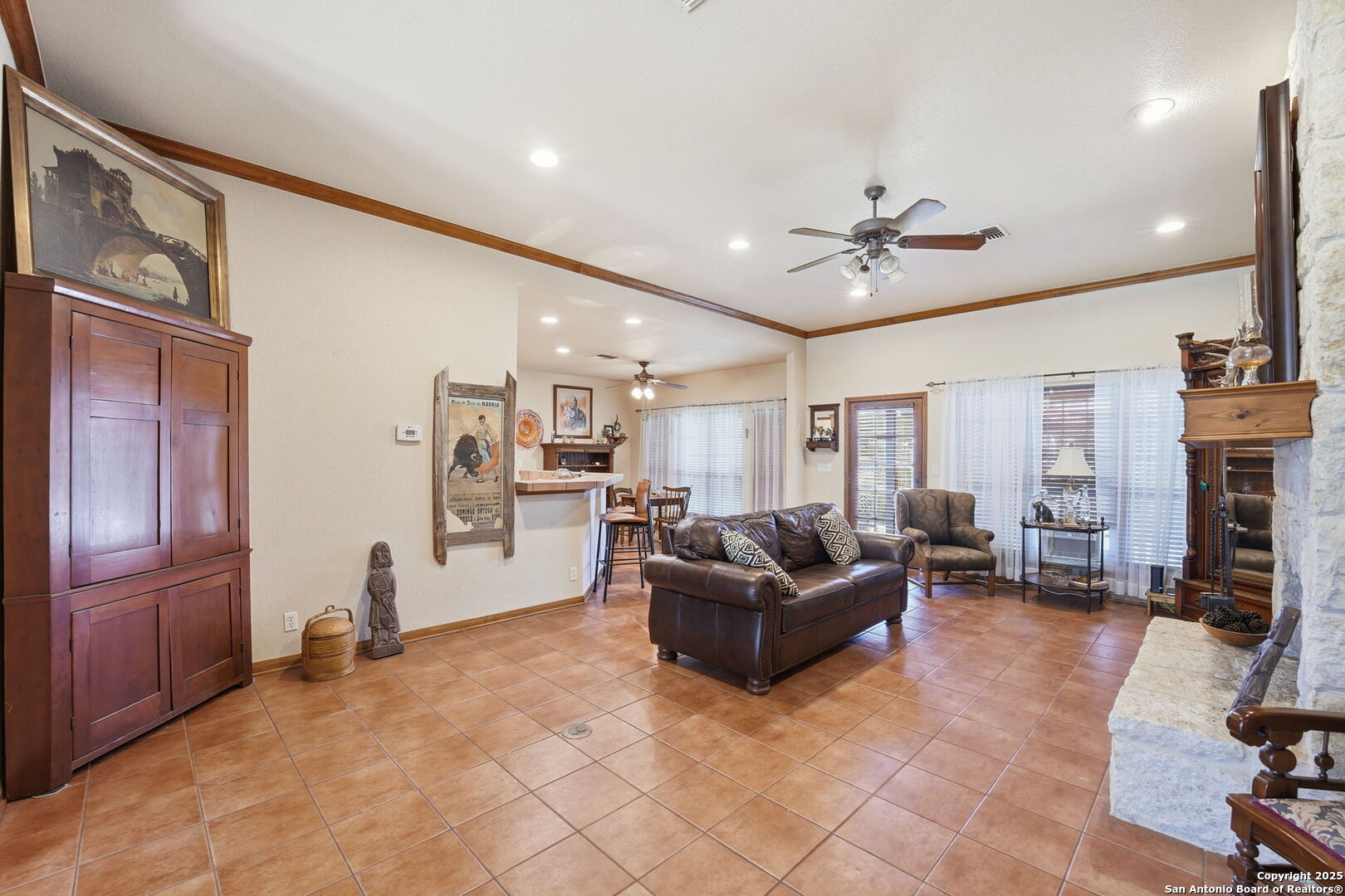 805 Paddy Road Floresville, TX 78114 - Photo 9 of 26 a living room with fireplace furniture and a flat screen tv