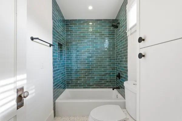 a bathroom with a shower and a toilet