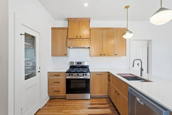 a kitchen with a stove and a sink