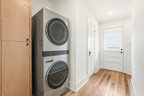a view of a hallway with washer and dryer
