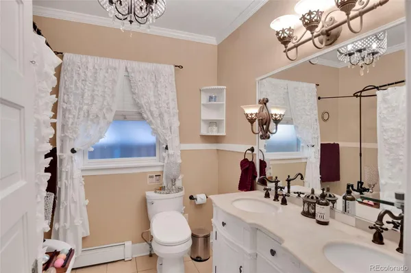 a bathroom with a sink mirror vanity and toilet