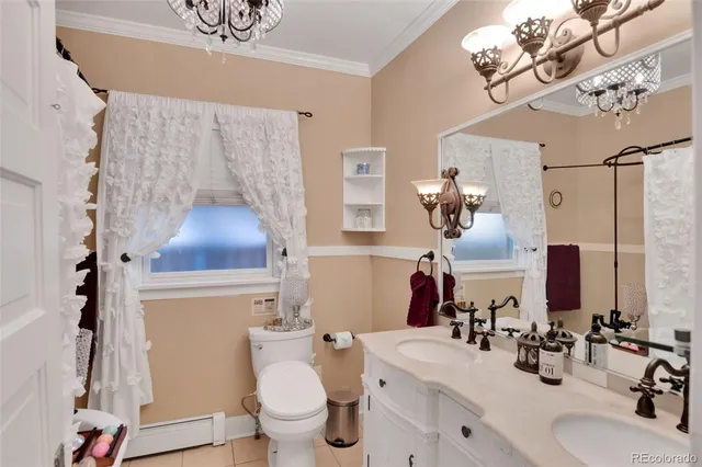 a bathroom with a sink mirror vanity and toilet
