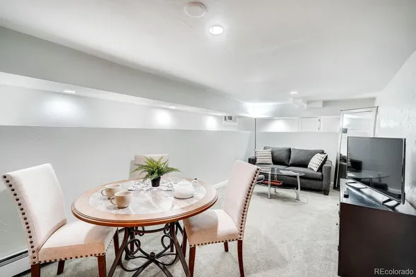 a living room with furniture and a table
