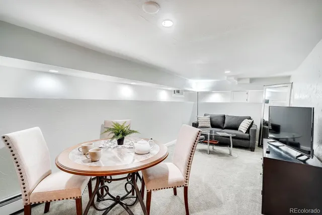 a living room with furniture and a table