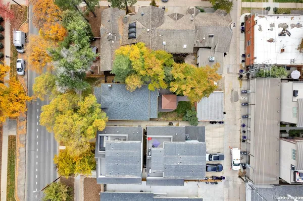a aerial view of multi story residential apartment building with yard