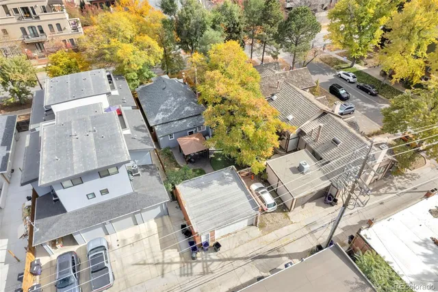 an aerial view of residential house with outdoor space and seating area
