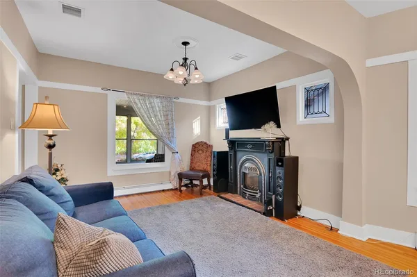 a living room with furniture and a fireplace