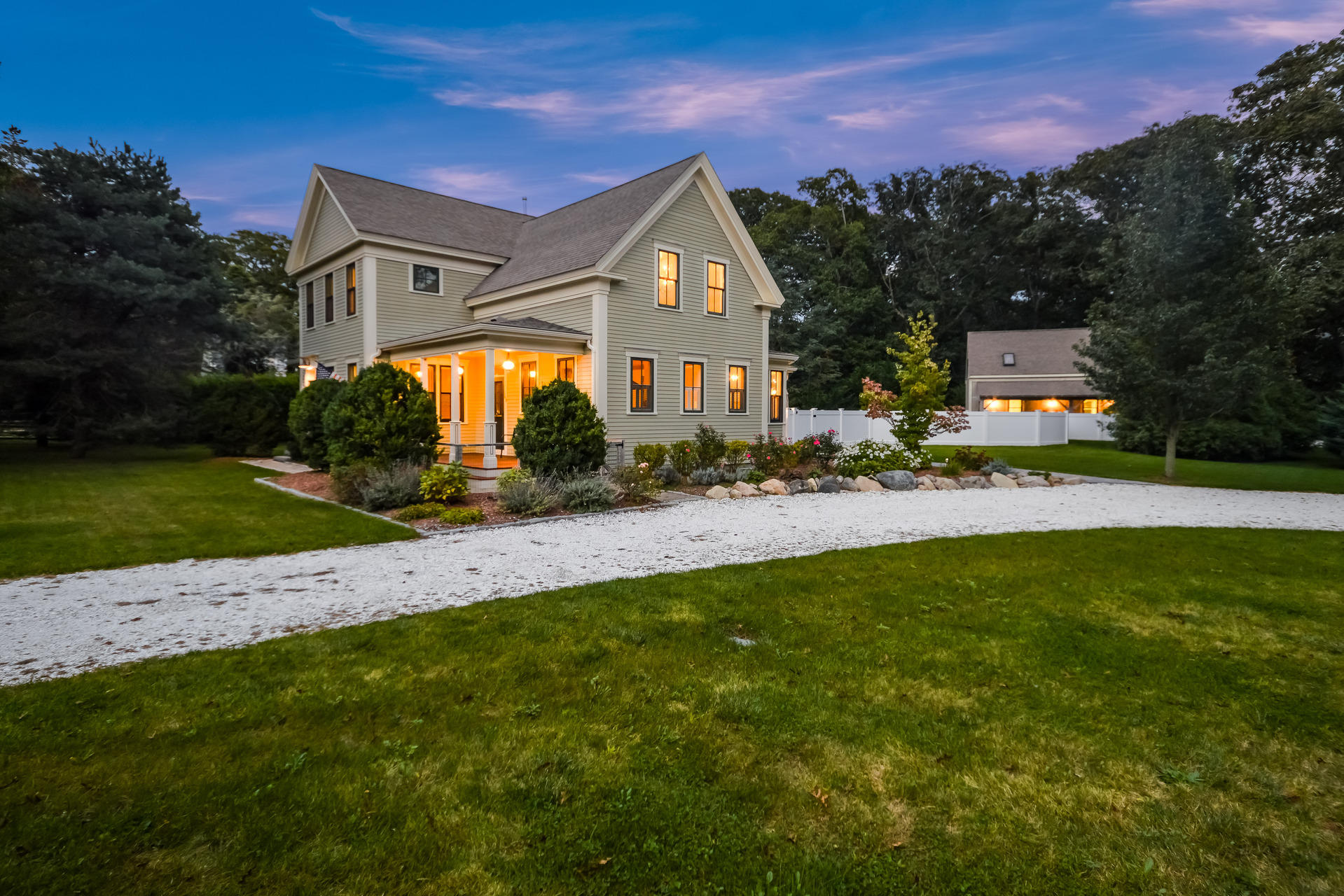 a front view of house with yard and green space