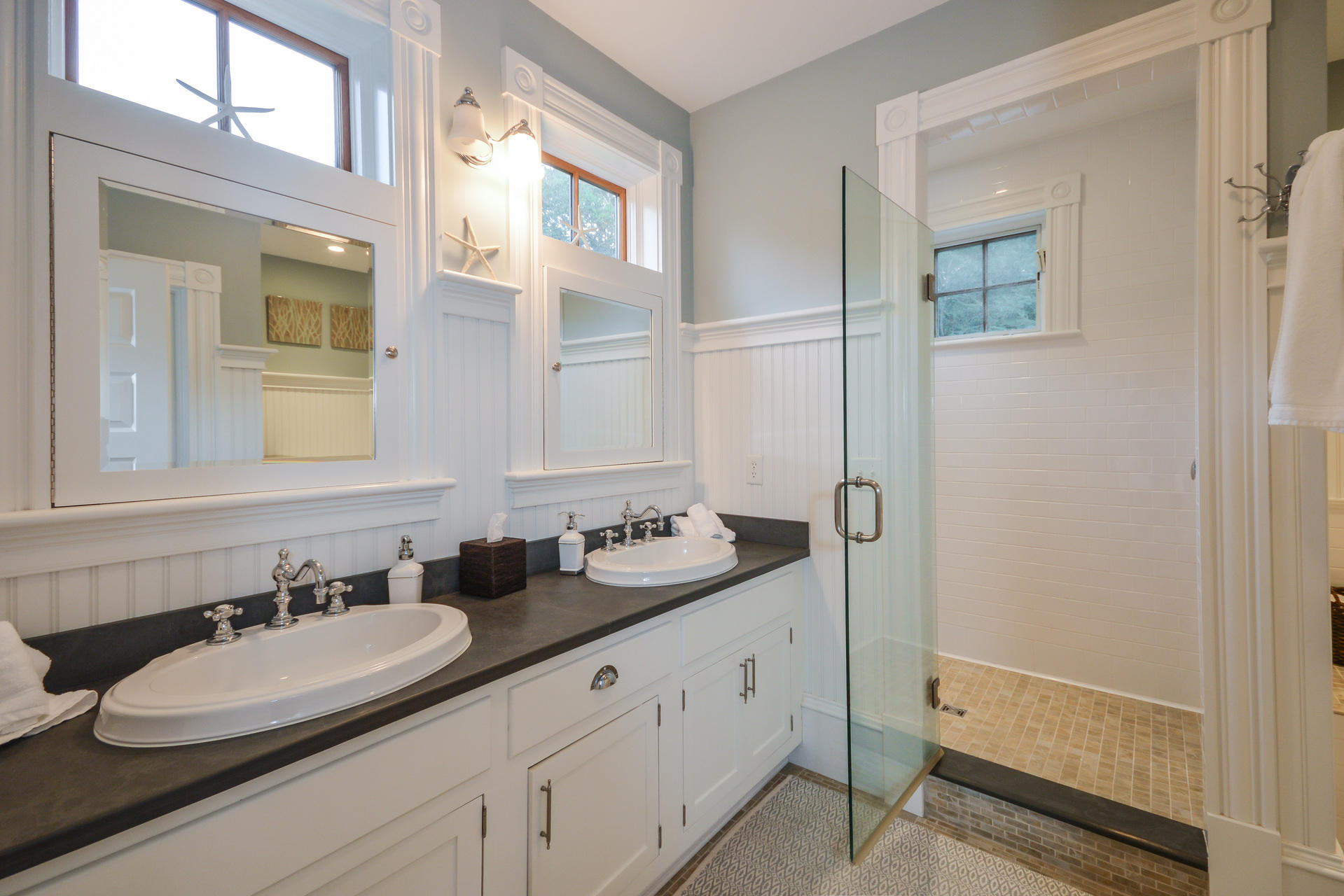 169 Tonset Road Orleans, MA 02653 - Photo 16 of 35 a bathroom with double vanity sinks and a mirror