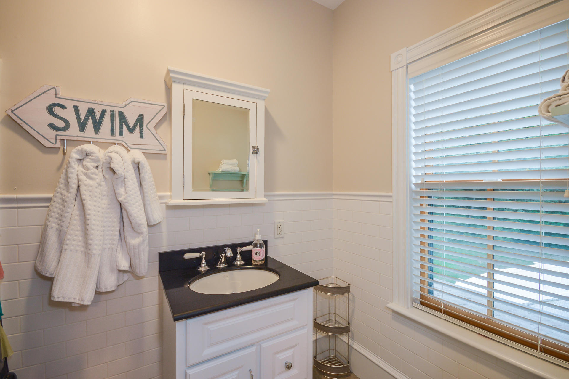 169 Tonset Road Orleans, MA 02653 - Photo 25 of 35 a bathroom with a sink and a mirror