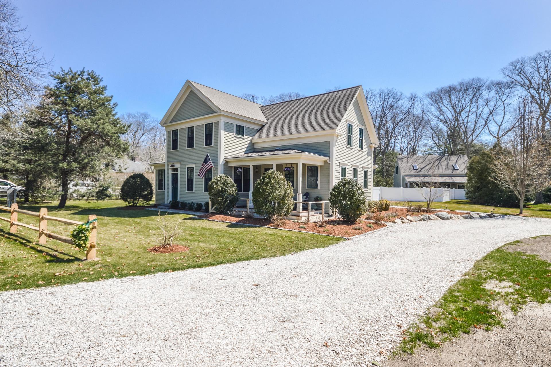 169 Tonset Road Orleans, MA 02653 - Photo 35 of 35 a view of a house with a yard and large trees