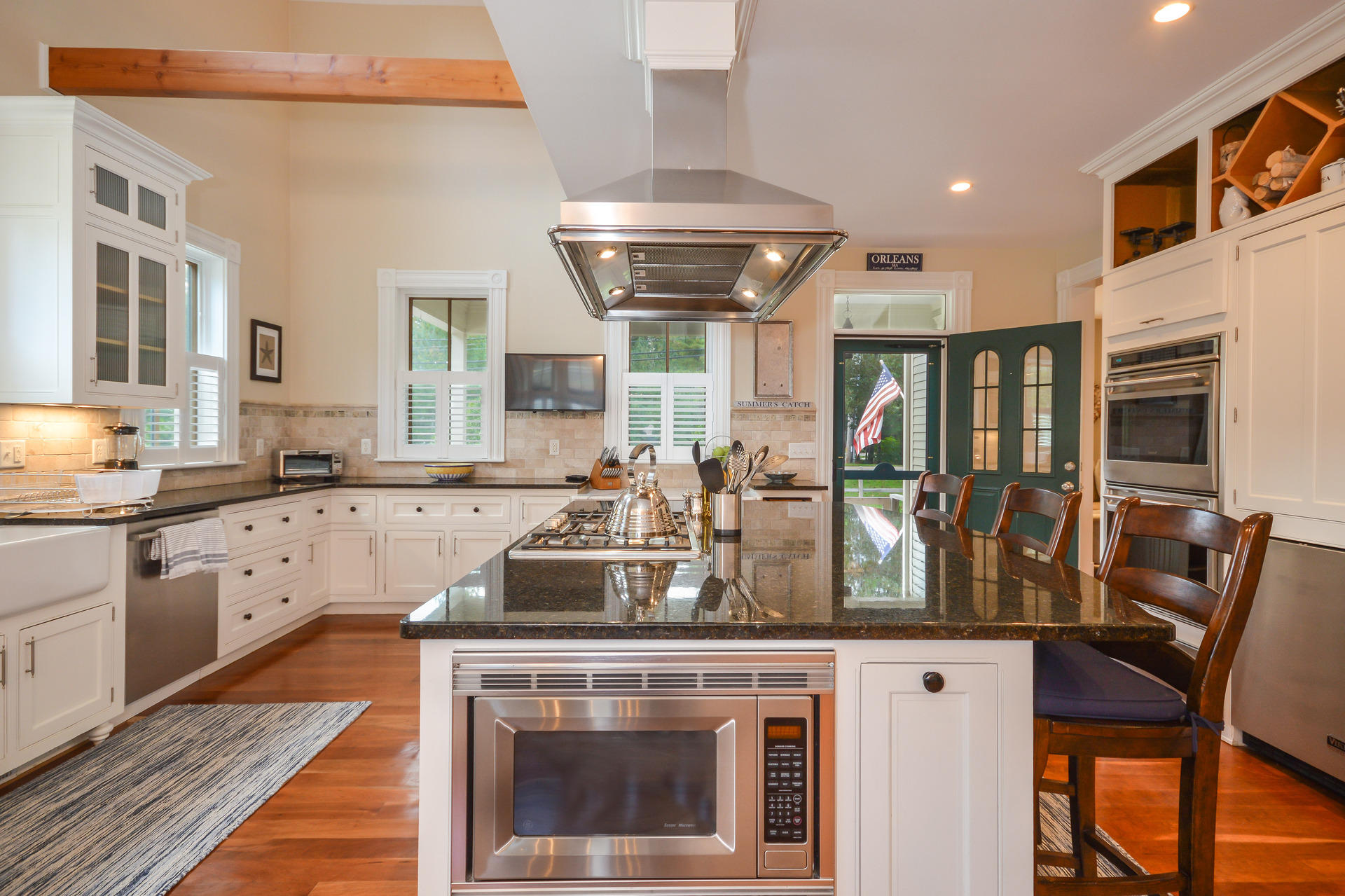 169 Tonset Road Orleans, MA 02653 - Photo 5 of 35 a kitchen with stainless steel appliances granite countertop a stove and a sink