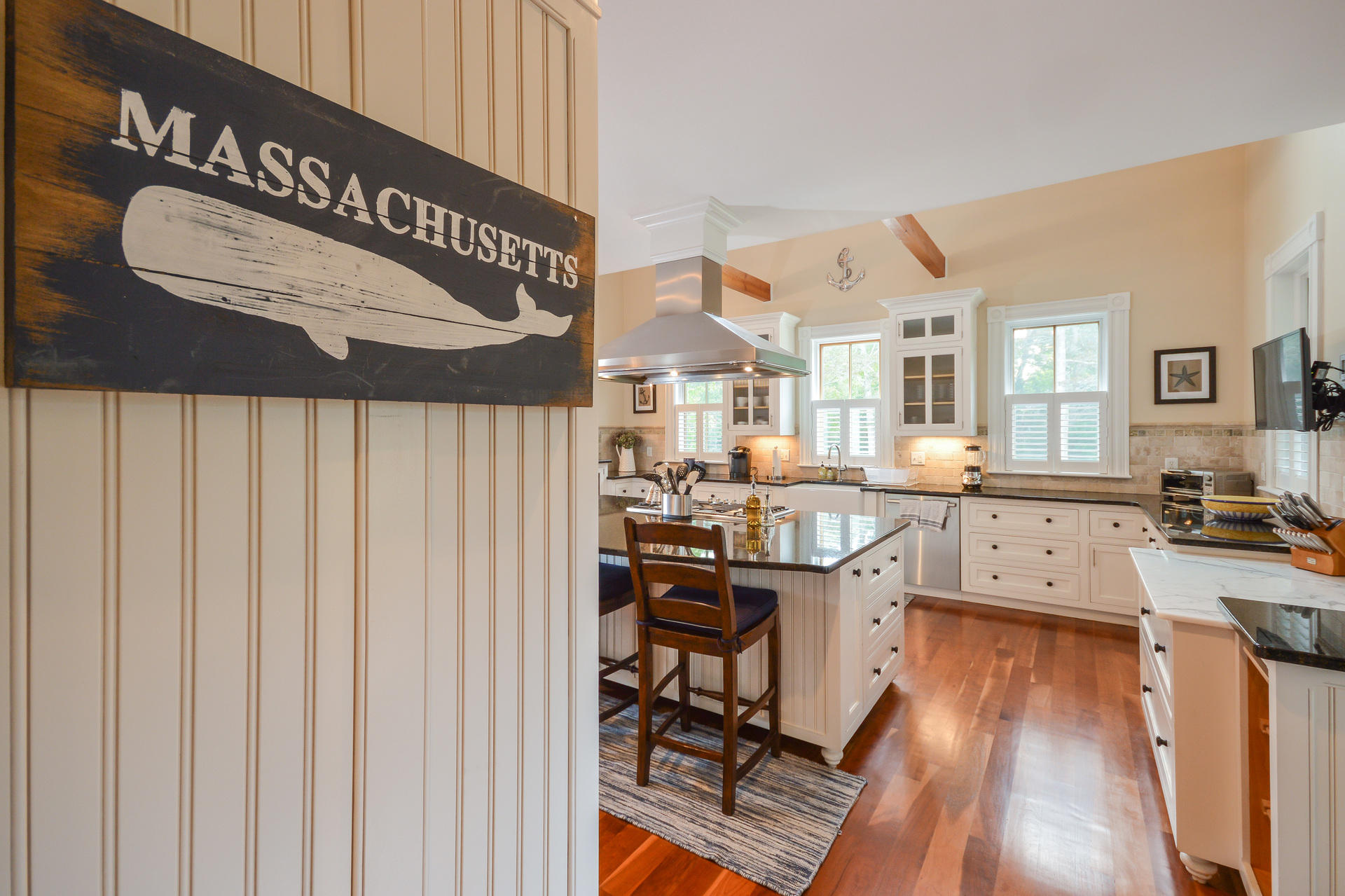169 Tonset Road Orleans, MA 02653 - Photo 6 of 35 a view of a kitchen with furniture and wooden floor