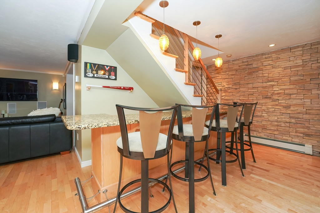 10 10 Rod Road Rutland, MA 01543 - Photo 24 of 42 a view of a dining room with furniture and wooden floor