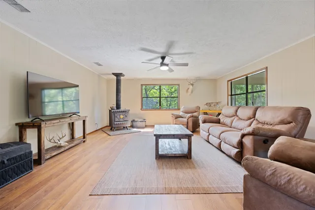 a view of a house with backyard porch and sitting area