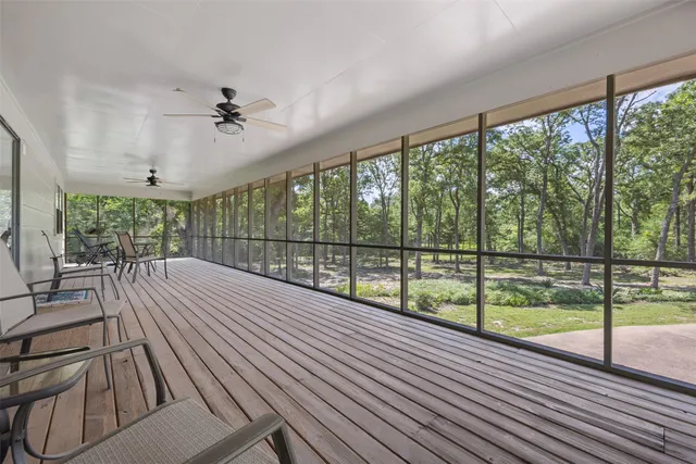 a view of a swimming pool with a yard