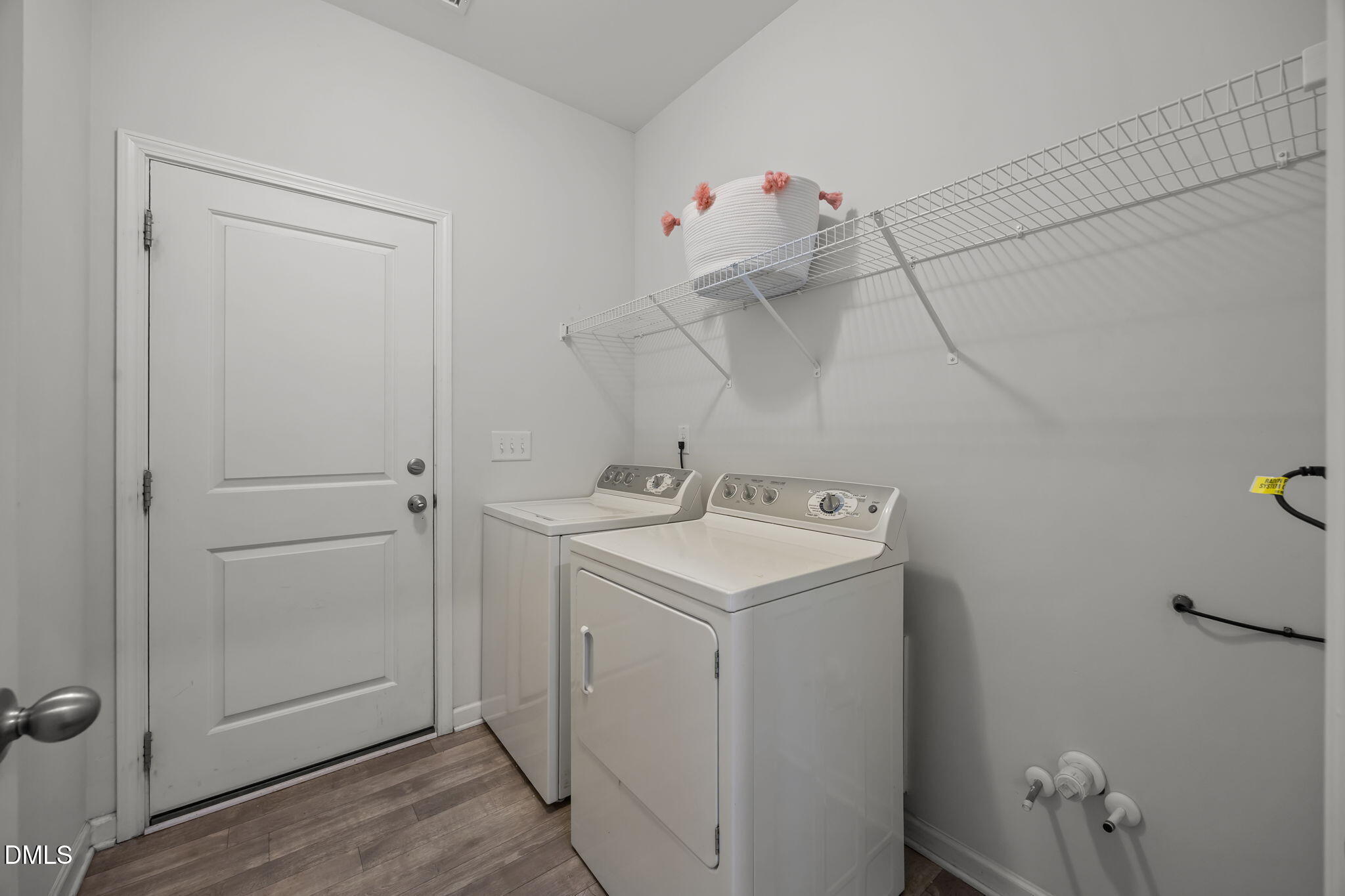 1525 Reynolds Mill Road Wake Forest, NC 27587 - Photo 18 of 40 a utility room with cabinets and washer