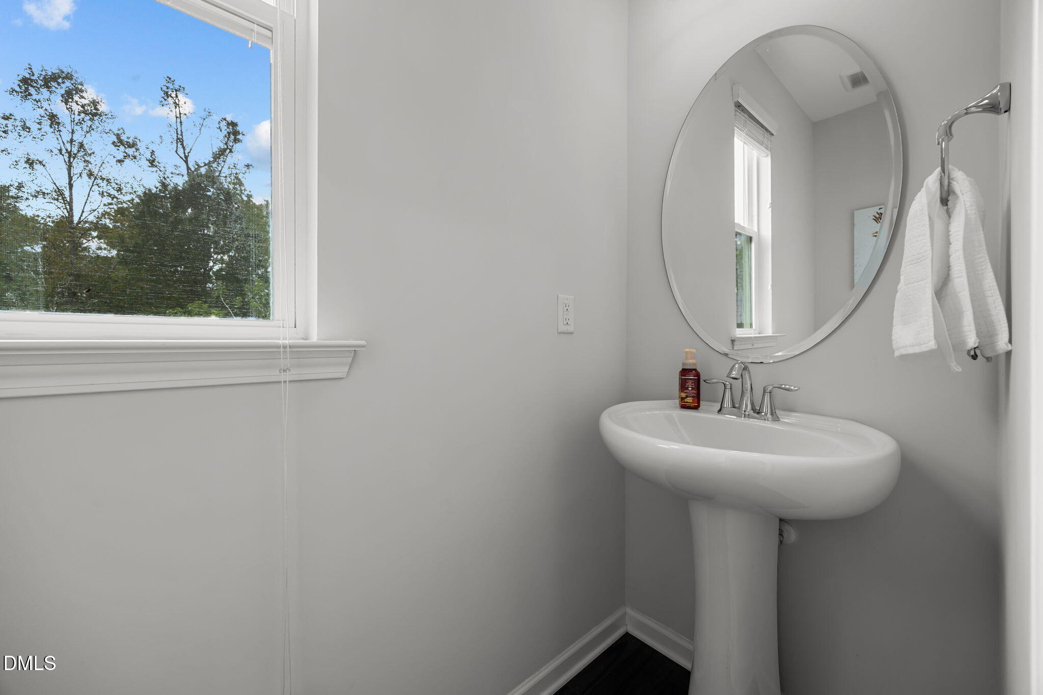 1525 Reynolds Mill Road Wake Forest, NC 27587 - Photo 20 of 40 a bathroom with a sink and a mirror