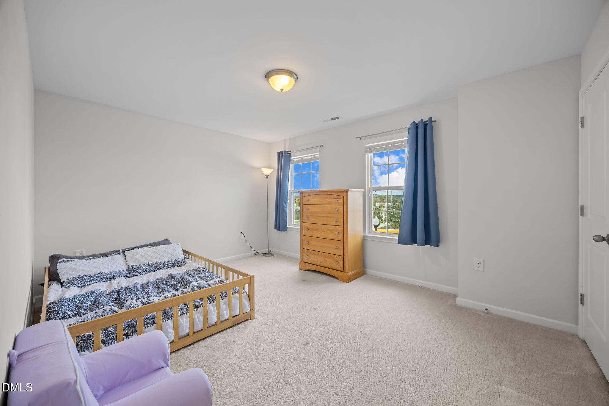 1525 Reynolds Mill Road Wake Forest, NC 27587 - Photo 24 of 40 a room with a bed and a couch