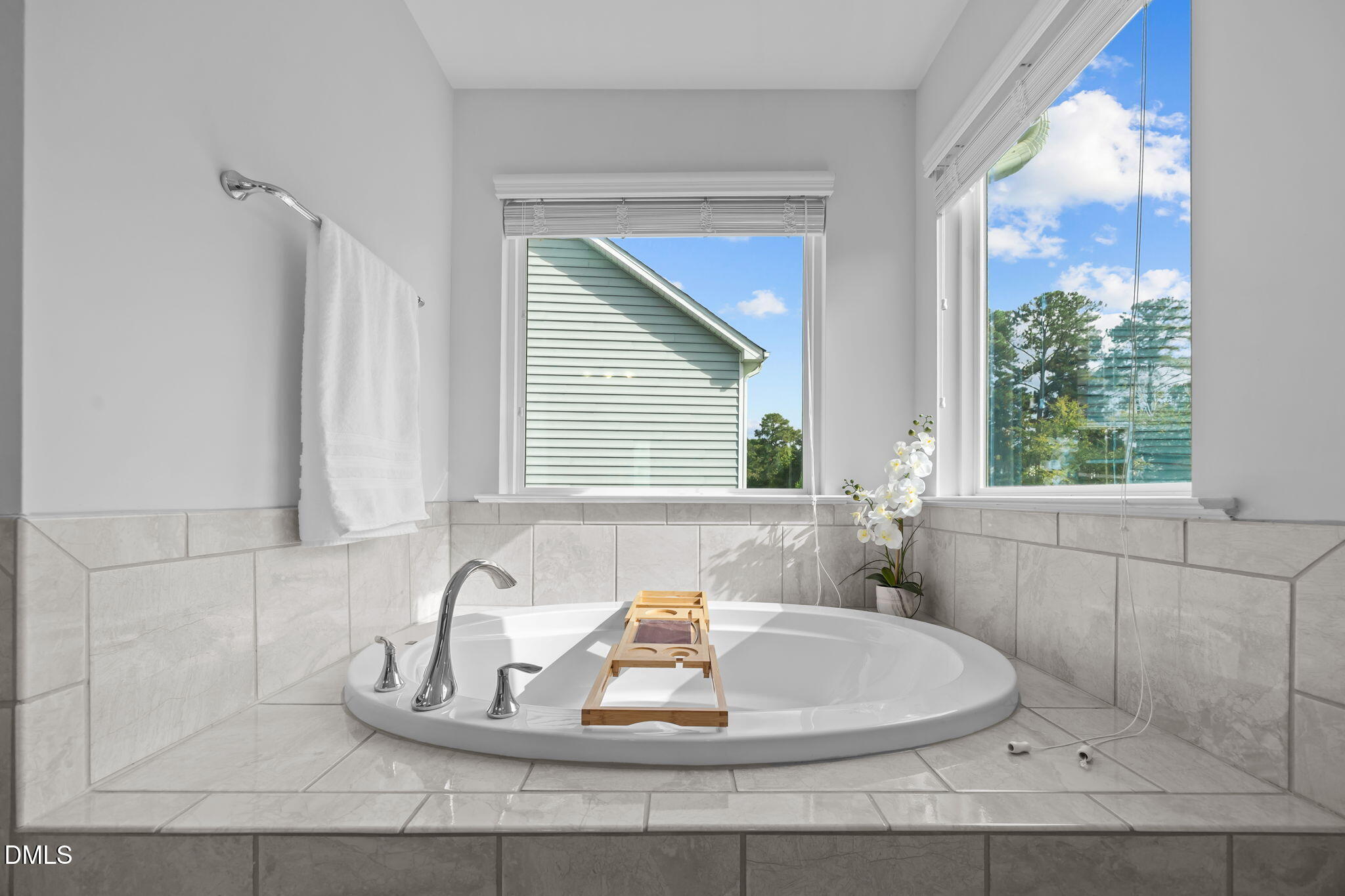1525 Reynolds Mill Road Wake Forest, NC 27587 - Photo 30 of 40 a bathroom with a bathtub and window