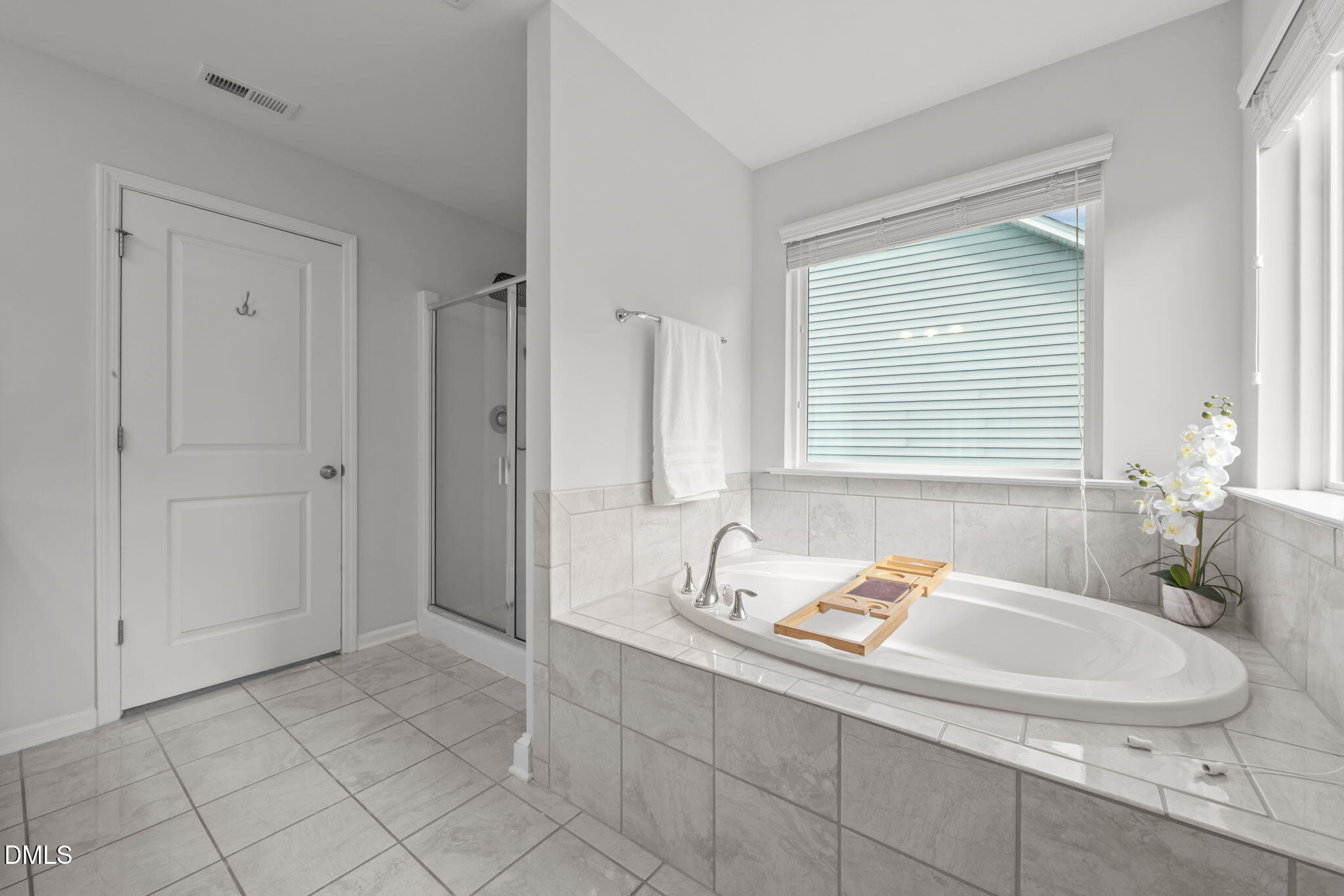 1525 Reynolds Mill Road Wake Forest, NC 27587 - Photo 31 of 40 a bathroom with a sink and a mirror
