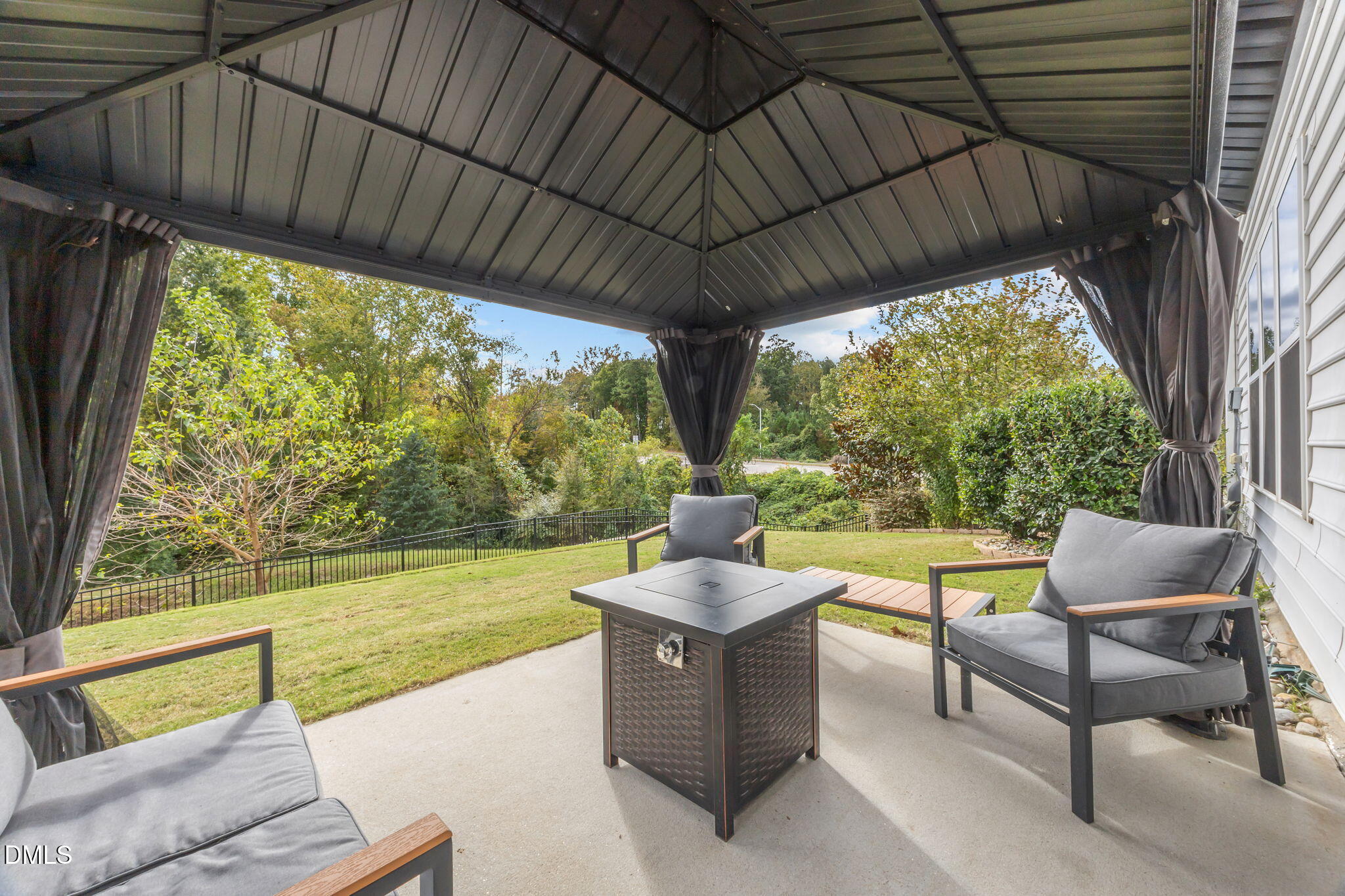 1525 Reynolds Mill Road Wake Forest, NC 27587 - Photo 36 of 40 a view of a couches in patio with a backyard