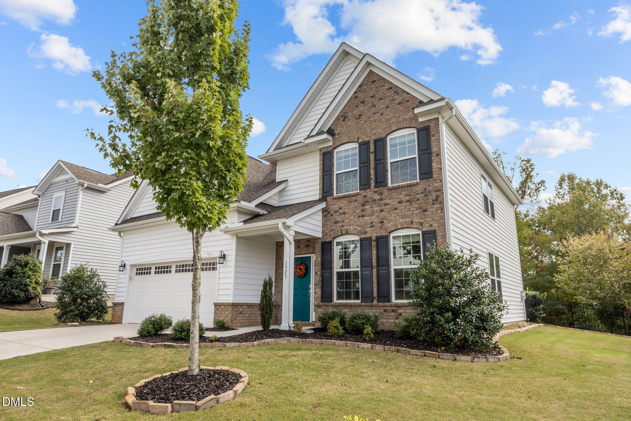 1525 Reynolds Mill Road Wake Forest, NC 27587 - Photo 3 of 40 a front view of a house with garden