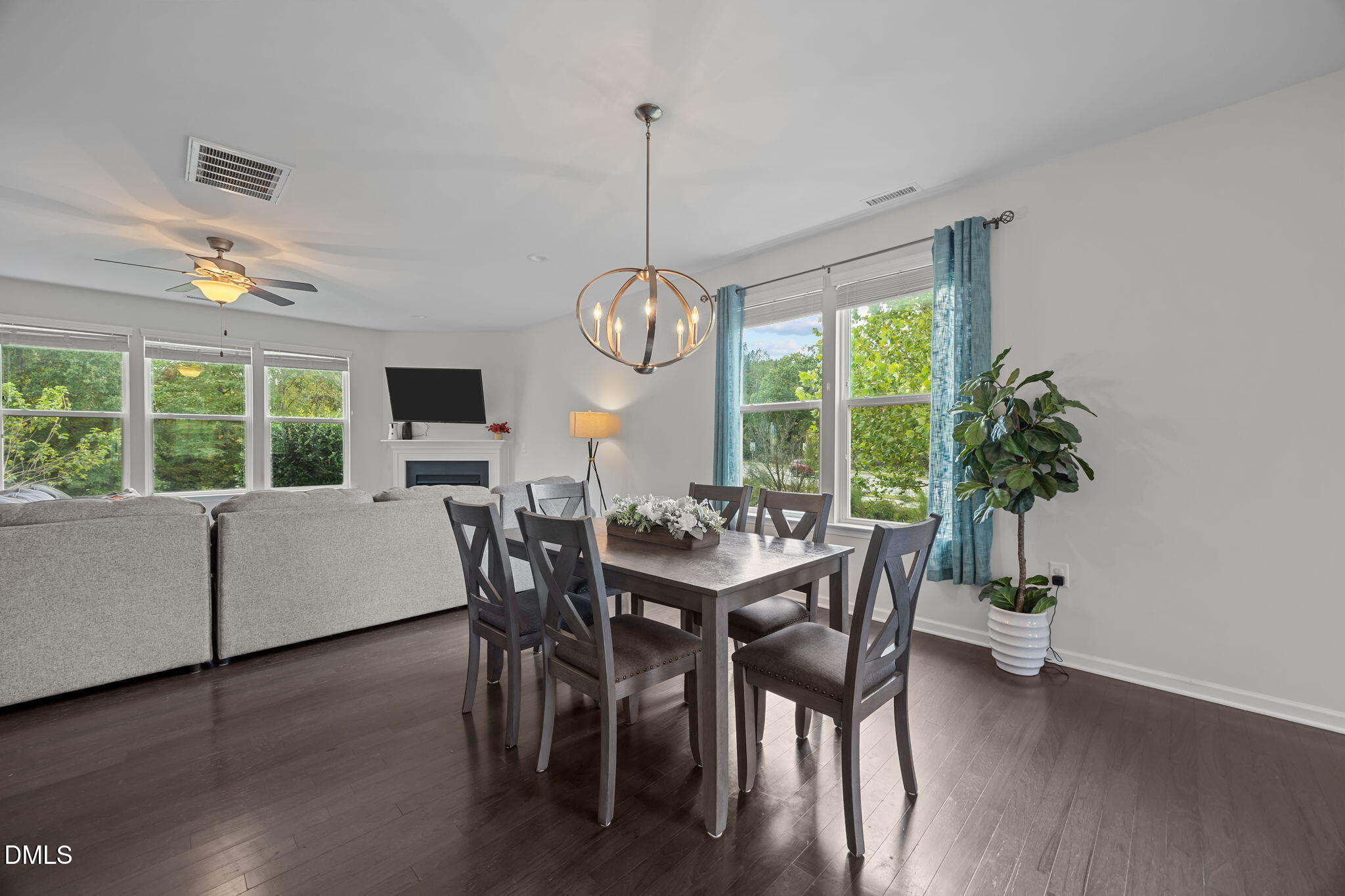1525 Reynolds Mill Road Wake Forest, NC 27587 - Photo 8 of 40 a dining room with furniture window wooden floor