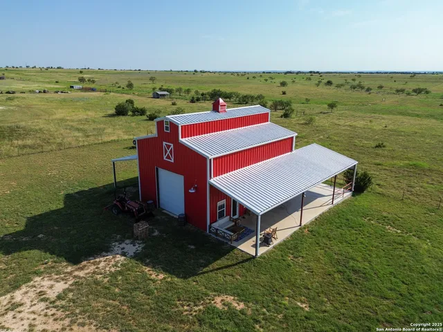 a aerial view of a house with a ocean view