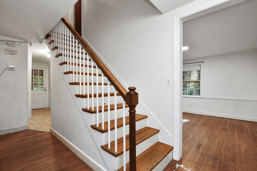 216 Hudson Road Sudbury, MA 01776 - Photo 3 of 39 a view of entryway with wooden floor