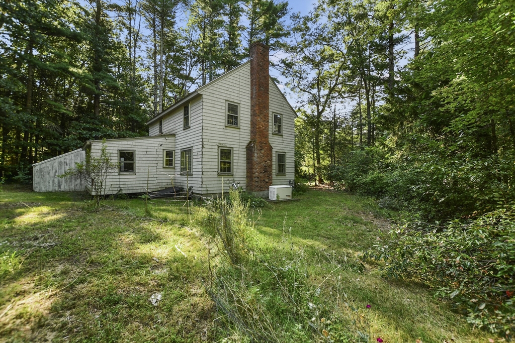 216 Hudson Road Sudbury, MA 01776 - Photo 34 of 39 a view of a house with backyard and garden