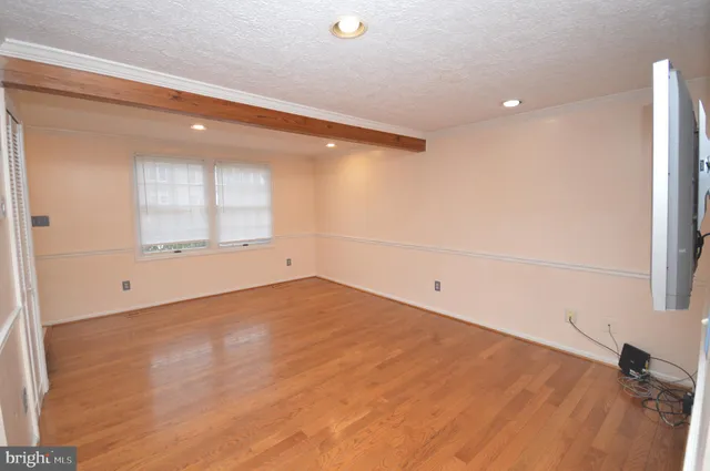 an empty room with a empty space and windows