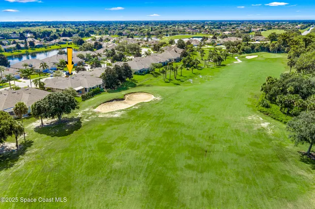 a kitchen with a refrigerator a stove a dining table and chairs with wooden floor