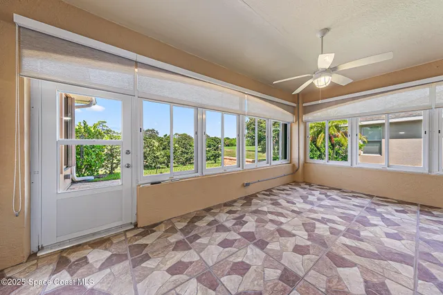 an aerial view of a house with a swimming pool