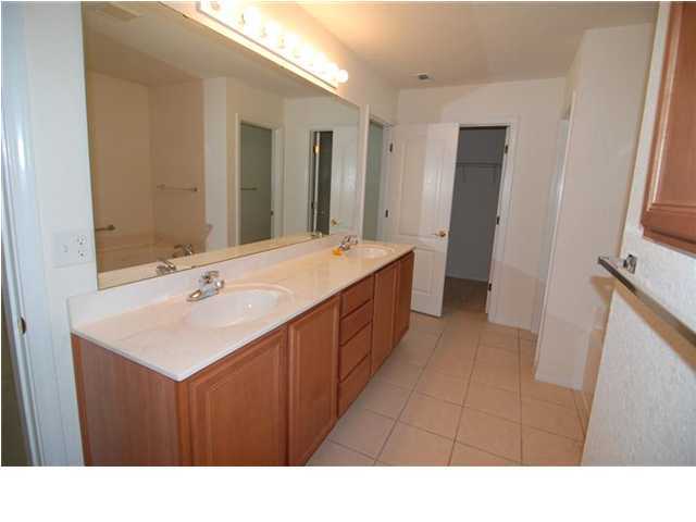 207 Shipwreck Road Santa Rosa Beach, FL 32459 - Photo 14 of 23 a bathroom with a sink a mirror and a toilet